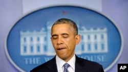 President Barack Obama pauses while making a statement in the Brady Press Briefing Room of the White House in Washington, May 30, 2014, following his meeting with Veterans Affairs Secretary Shinseki.