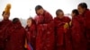 FILE - Tibetan monks attend a ceremony at the Langmu Lamasery during the "Sunbathing Buddha Festival", in Gannan Tibetan Autonomous Prefecture, Gansu Province, China, Feb. 17, 2019.