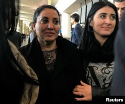 An Iraqi woman, Iman Alknfosche, is embraced by her daughter Elaf Hussain after she was released by ICE after arriving at John F. Kennedy International Airport, New York, Jan. 29, 2017. Alknfosche was held for about 30 hours.