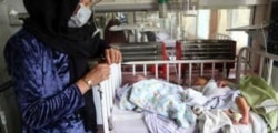 FILE - Babies lie in their beds at the Ataturk Children's Hospital a day after they were rescued following a deadly attack on another maternity hospital, in Kabul, May 13, 2020.