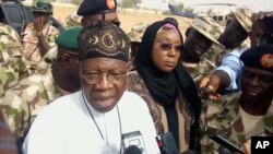 In this image taken from video, Lai Muhammed, Nigerian Minister of Information, speaks to the media in Dapchi, Yobe State, Nigeria, Feb. 22, 2018. 