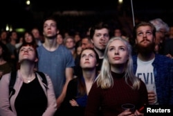 People listen to Dutch Green Party (Groen Links) leader Jesse Klaver during a meeting for the 2017 Dutch election in the AFAS theater in Amsterdam, Netherlands, March 9, 2017.