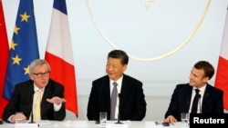 French President Emmanuel Macron, his Chinese counterpart Xi Jinping and European Commission President Jean-Claude Juncker hold a news conference with German Chancellor Angela Merkel at the Elysee presidential palace in Paris, France, March 26, 2019.