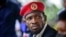 Presidential challenger Bobi Wine speaks to the media outside his home, in Magere, near Kampala, Uganda, Jan. 26, 2021. 