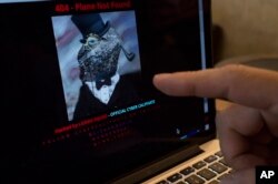 FILE - A computer screen shows Malaysia Airlines' hacked website on Jan. 26, 2015.