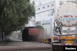 A truck transports coal at a coal-fired power plant in Shenyang, Liaoning province, China September 29, 2021. (REUTERS/Tingshu Wang)