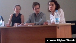 Edward Snowden at Moscow's Sheremetyevo airport July 12, 2013, with Sarah Harrison of Wikileaks on the left side of the photo.