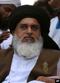 FILE - Khadim Rizvi, leader of the religious party, Tehreek-e-Labbaik Pakistan, leads a rally to condemn a cartoon contest by a Dutch parliamentarian, in Karachi, Pakistan, Aug. 12, 2018.