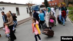 Syrian refugees arrive at the camp for refugees and migrants in Friedland, Germany, April 4, 2016.