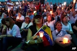 Opponents to Venezuela's President Nicolas Maduro hold a vigil for those killed in street fighting over the past week in Caracas, Venezuela, May 5, 2019.