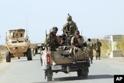 Afghan National Army soldiers arrive to start an operation soon, outside of Kunduz city, north of Kabul, Sept. 30, 2015.