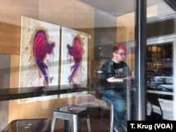 LGBTQ advocate Freddi Funnell sits at a cafe in Ames, Iowa, Oct. 27, 2018. He started a support group last year for people in central Iowa who identify as transgender or non-binary.