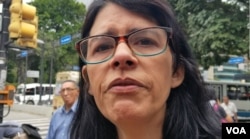 Luisa Mago Machado: 'I've spent all Christmas without medicine and that's why I'm crying.' (N. Kolster/VOA)