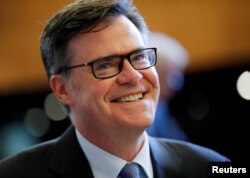 FILE - Dennis Shea U.S. Ambassador to the WTO arrives for the General Council meeting at the World Trade Organization in Geneva, Switzerland, July 26, 2018.