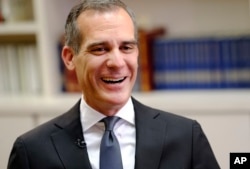 FILE - In this Thursday, Aug. 16, 2018, file photo, Los Angeles Mayor Eric Garcetti talks during an interview with The Associated Press in Los Angeles.