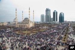 Chechen demonstrators gathered during a massive rally in Grozny, Chechnya Republic, in support of strongman leader Ramzan Kadyrov and Russian President Vladimir Putin, Friday, Jan. 22, 2016.