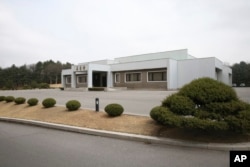 FILE - North Korea's Tongilgak building, the site for the high-level talks between two Koreas, is seen at the northern side of the Panmunjom in North Korea, March 29, 2018.