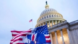 FILE - A flag depicting President Donald Trump flies on the East Front of the US Capitol on Jan. 6, 2021, in Washington.