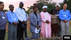 Representatives of the Christian, Muslim, Hindu, and Buddhist faiths pray for Africa's wildlife at the historic Ivory Burning Site in Nairobi National Park, Kenya, September 20, 2012. (J. Craig/VOA)