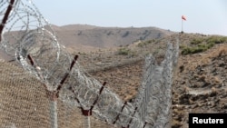 A view of the border fence outside the Kitton outpost on the border with Afghanistan in North Waziristan, Pakistan, Oct. 18, 2017.