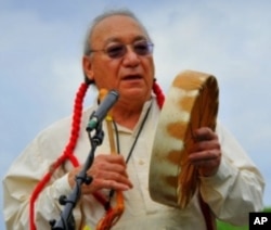 Mario Garza speaks about the census at a pow-wow in Texas.