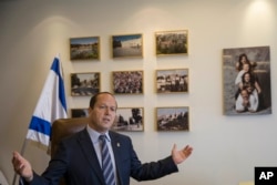 Jerusalem Mayor Nir Barkat speaks during an interview with The Associated Press in Jerusalem, Feb. 27, 2018.
