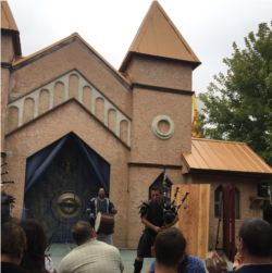 Bagpipe player, Nate Silva, and drummer play at a Maryland Renaissance Festival.