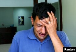 Abdullah Kurdi, father of three-year old Alan Kurdi, cries as he leaves a morgue in Mugla, Turkey, Sept. 3, 2015.