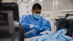 U.S. Army Specialist Fredrick Spencer assembles a T1 Hamilton ventilator in a mobile lab unit in the Javits New York Medical Station intensive care unit bay monitoring coronavirus disease (COVID-19) patients in New York City, U.S. Apri 4, 2020. Picture ta
