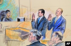 FILE - A court artist drawing shows President Donald Trump's former campaign chairman, Paul Manafort, center standing and Manafort's business associate, Rick Gates, in federal court in Washington, Oct. 30, 2017, before U.S. Magistrate Judge Deborah A. Robinson.