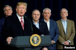 U.S. President Donald Trump speaks to reporters after a congressional Republican leadership retreat at Camp David, Md., Jan. 6, 2018. From left are House Majority Leader Kevin McCarthy, R-Calif., Trump, House Majority Whip Steve Scalise, R-La., Secretary of State Rex Tillerson and Defense Secretary Jim Mattis.