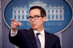 FILE - Treasury Secretary Steven Mnuchin takes a question from a reporter in the Briefing Room of the White House in Washington, Oct. 11, 2019.