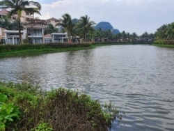 The central beach town of Danang is among those in Vietnam that set up checkpoints to limit movement. (VOA News)