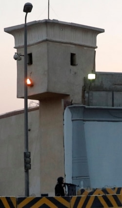 A security member is seen near a control tower outside Cairo's Tora prison in Egypt, June 17, 2019.