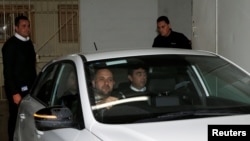 Melvin Theuma, who allegedly acted as a middleman in a plot to murder of journalist Daphne Caruana Galizia, is seen in a police car as he leaves the Courts of Justice in Valletta, Malta, Dec. 4, 2019. 
