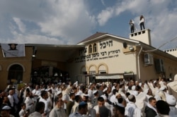 FILE - Orthodox Jewish pilgrims pray at the tomb of Rabbi Nachman of Breslov during the celebration of the Rosh Hashanah holiday, the Jewish New Year, in Uman, Ukraine, Sept. 21, 2017.
