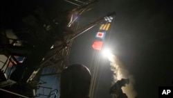 The USS Ross (DDG 71) fires a tomahawk land attack missile Friday from the Mediterranean Sea, April 7, 2017.