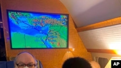 Jonathan Pollard and his wife Esther sit inside a private plane provided by American casino magnate Sheldon Adelson, on route to land in Ben Gurion International airport near Tel Aviv, Israel, Dec. 30, 2020. 