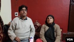 The family of jailed photojournalist Manan Gulzar Dar, pictured at the family's home in the Batamaloo locality of Srinagar in Kashmir. (Bilal Hussein/VOA)