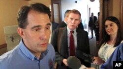 Wisconsin Gov. Scott Walker speaks to the media Tuesday, Aug. 1, 2017, in Madison, Wis.