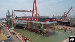 2022年6月17日中国第三艘航空母舰”福建舰“在上海船坞举行命名仪式