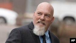 FILE - Richard Barnett arrives at federal court in Washington, Jan. 10, 2023. 