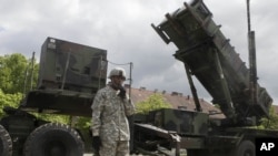 A U.S. soldier stands next to a Patriot surface-to-air missile battery at an army base in Morag, Poland. (File)