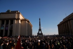 Demonstrators gather during a protest against a bill on police images, in Paris, Nov. 21, 2020.