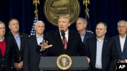 President Donald Trump, center, accompanied by from left, Senate Majority Leader Mitch McConnell of Kentucky, Vice President Mike Pence, House Majority Leader Kevin McCarthy of California, House Majority Whip Steve Scalise, R-La., and Secretary of State Rex Tillerson, speaks after participating in a Congressional Republican Leadership Retreat at Camp David, Md., Jan. 6, 2018.