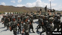 រូបឯកសារ៖ ទាហានចិន​ចូលរួម​ពិធី​បើក​សម្ពោធ​សមយុទ្ធ​យោធា​រួម​រវាង​ចិន​និង​កម្ពុជា​ នៅខេត្ត​កំពង់ស្ពឺ ប្រទេស​កម្ពុជា កាលពីថ្ងៃទី១៧ ខែមីនា ឆ្នាំ២០១៨។ 