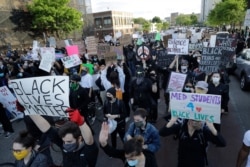 Protesters demonstrate May 31, 2020, in Boston, over the death of George Floyd, a black man who died in police custody in Minneapolis.