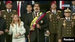 Venezuelan President Nicolas Maduro reacts during an event that was interrupted, reportedly by explosives from drones, in this still frame taken from government video, Aug. 4, 2018, in Caracas, Venezuela. 