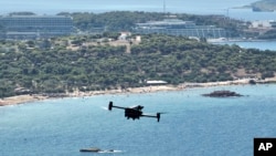 Greece Wildfire DronesA long-range drone equipped with thermal imaging cameras and a sophisticated early warning system patrols over Kavouri beach and nearby woodland, in southern Athens, Greece, Aug. 17, 2023. 