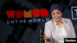 FILE - Gulchehra Hoja, a Uyghur journalist who then worked for Radio Free Asia, speaks on stage at the Women in the World Summit in New York, April 11, 2019.